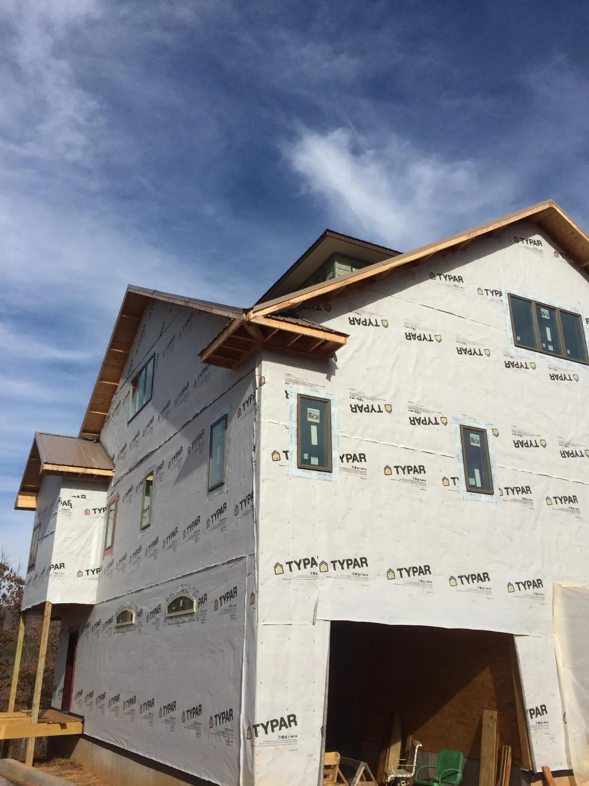 Stick built house wrapped in Typar with new roof framing and dormers in Park Hall